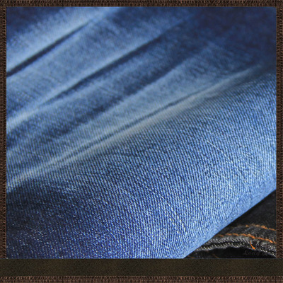 【布廠價供應(yīng)四片右斜 棉滌彈牛仔面料 12盎司秋冬時裝面料款】價格,廠家,圖片,棉面料,東莞市龍誼紡織-